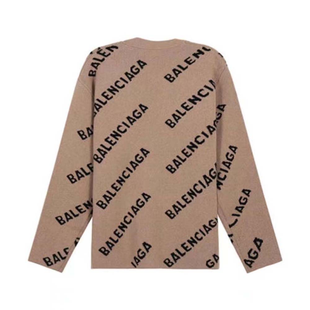 Close-up detail of Balenciaga logo knit pattern on cardigan cotton fabric