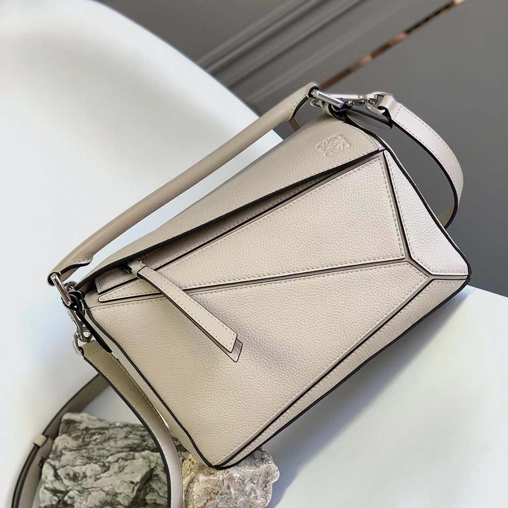 Close-up of signature puzzle panel stitching on Loewe bag