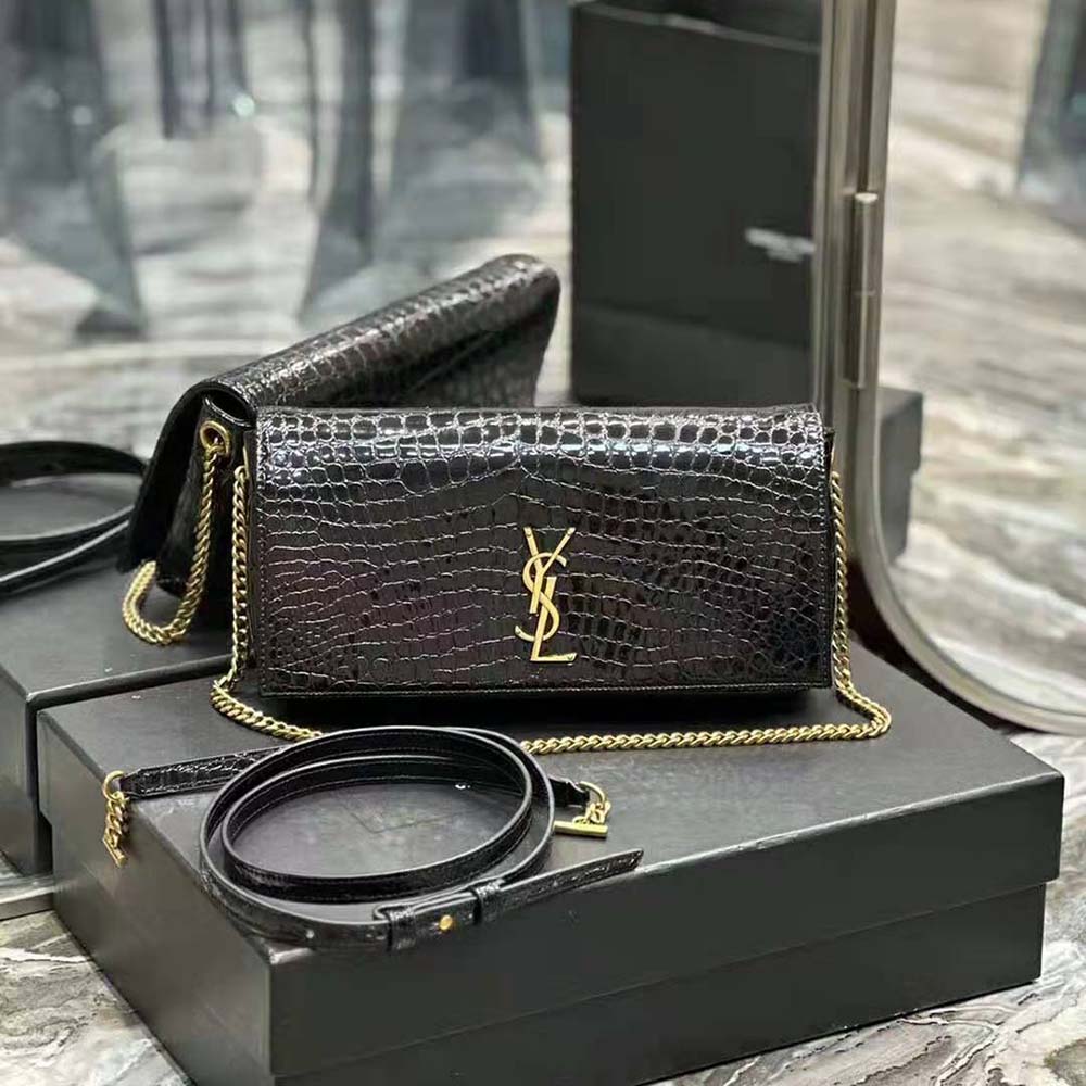 Close-up of gold YSL chain hardware on reversible Saint Laurent Kate bag