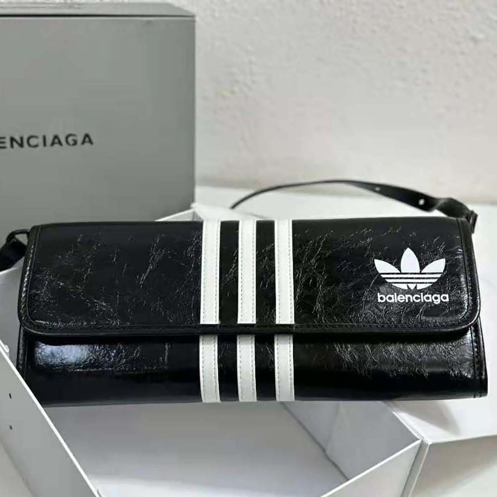 Close-up of Balenciaga and Adidas logos on wallet hardware