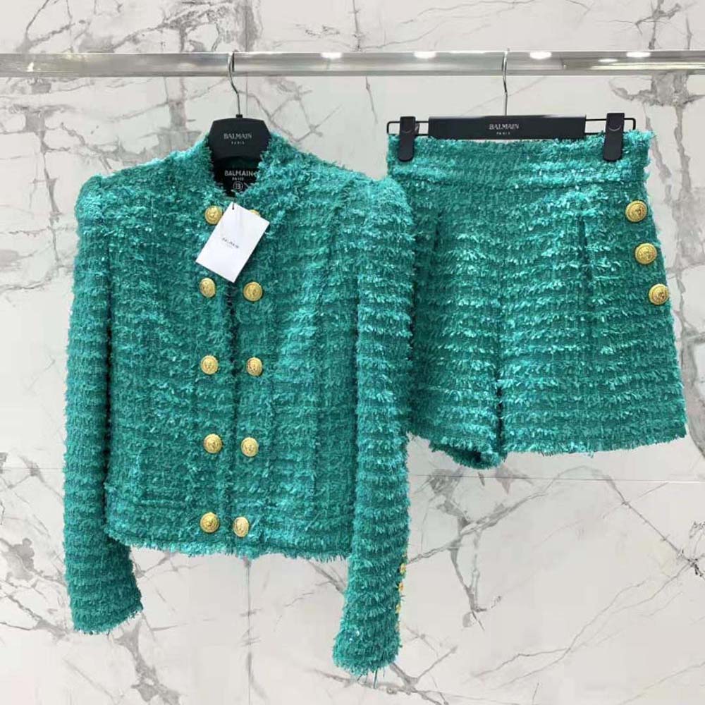 Close-up of Balmain Women Flared Tweed Shorts-Green gold-tone button detail
