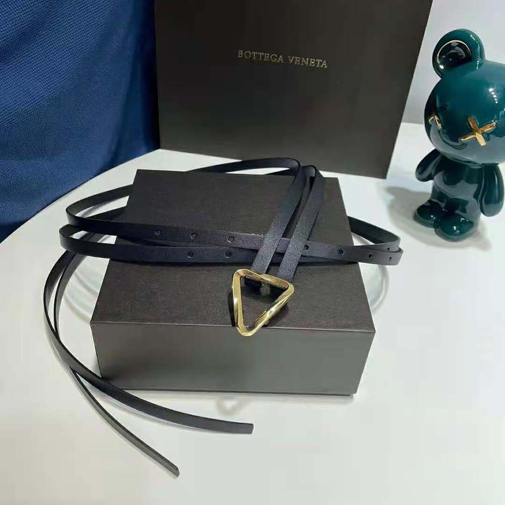 Close-up on the polished gunmetal buckle of Bottega Veneta Women Grasp Belt