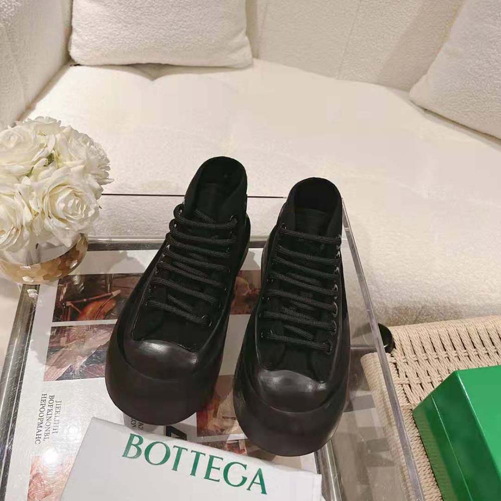 Close-up of chunky sole and lace-up detail on Bottega Veneta sneaker