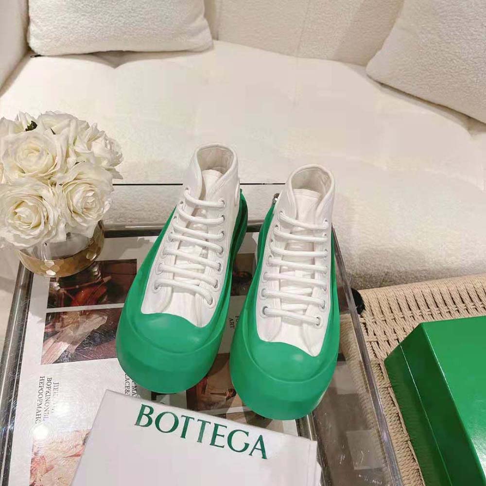 Top-down view showing high-top design and padded collar of Bottega Veneta green sneakers