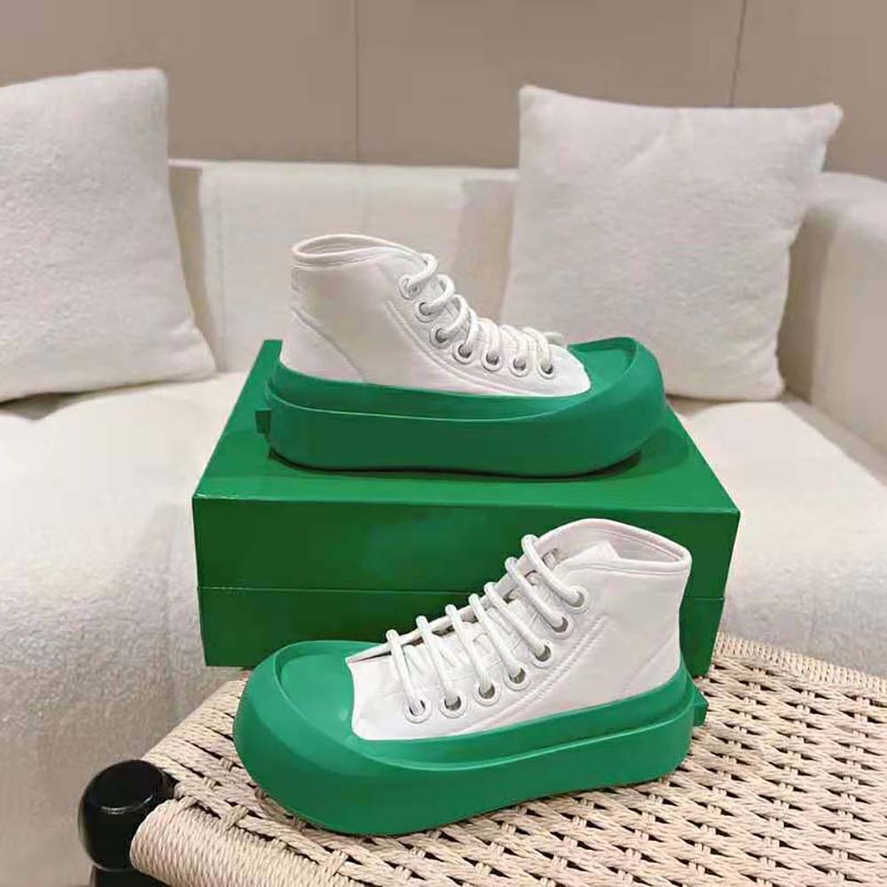 Close-up on lace-up detail and branded hardware of Bottega Veneta Unisex Jumbo Sneaker Nylon Green