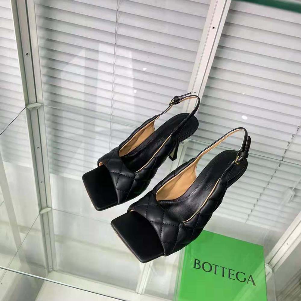 Close-up of padded strap and intrecciato detail on Bottega Veneta sandal heel
