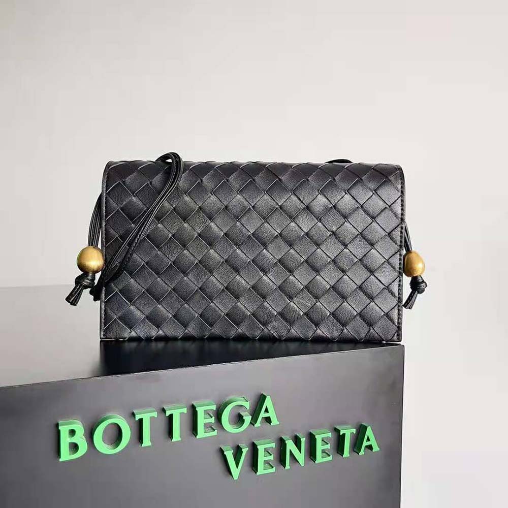 Side profile showing matte hardware and strap detail on Bottega Veneta Women Trio Pouch On Strap