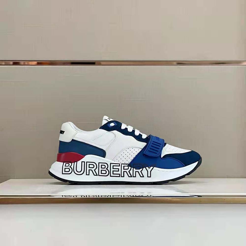 Close-up on blue leather texture and printed logo of Burberry sneakers