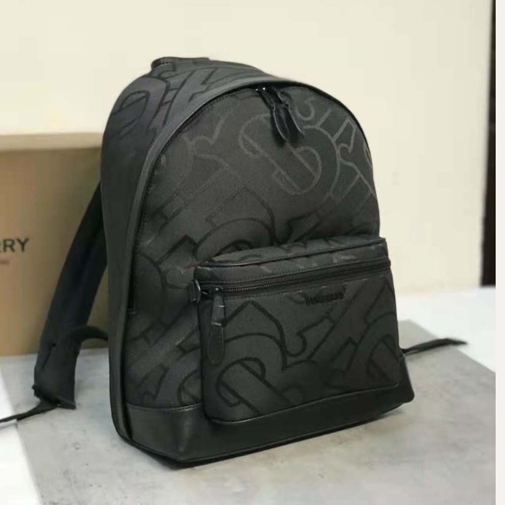 Side angle showing leather trim and zip closure of backpack