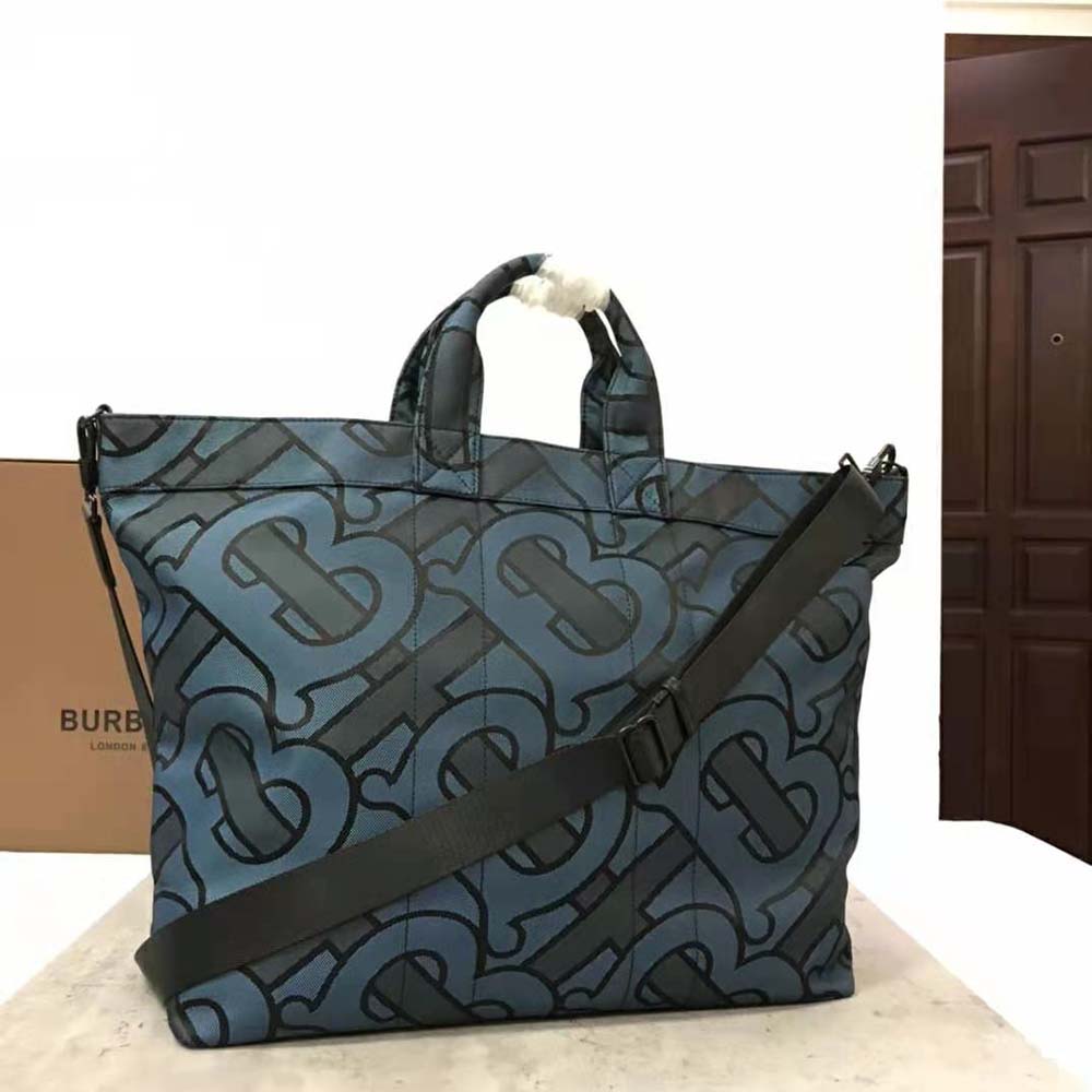 Side angle showing silver-tone hardware on Burberry Men Ormond Tote