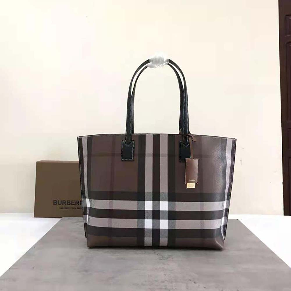 Close-up of gold-tone hardware and signature check on Burberry tote