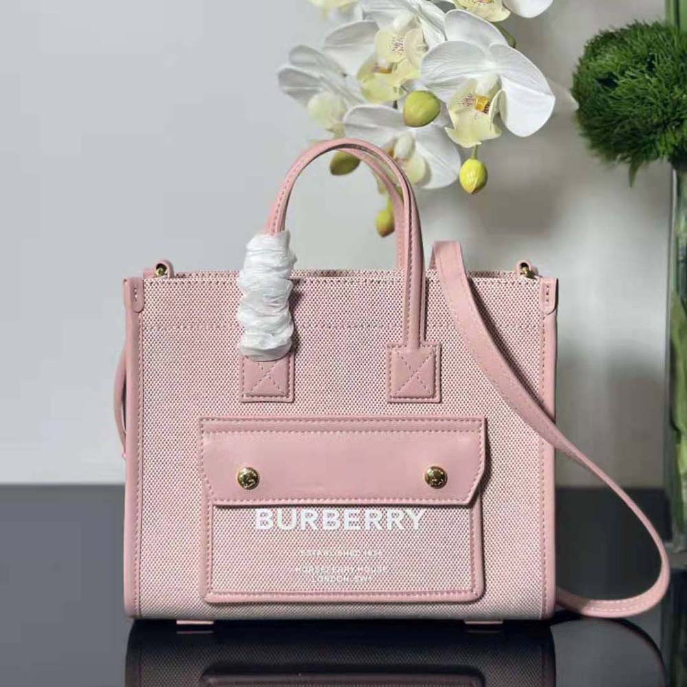 Close-up of gold-tone hardware on Burberry Women Mini Freya Tote-Pink