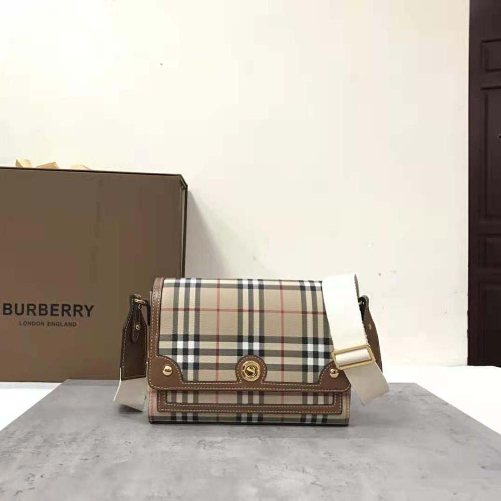 Close-up of gold-tone logo-engraved studs on Burberry Women Note Bag
