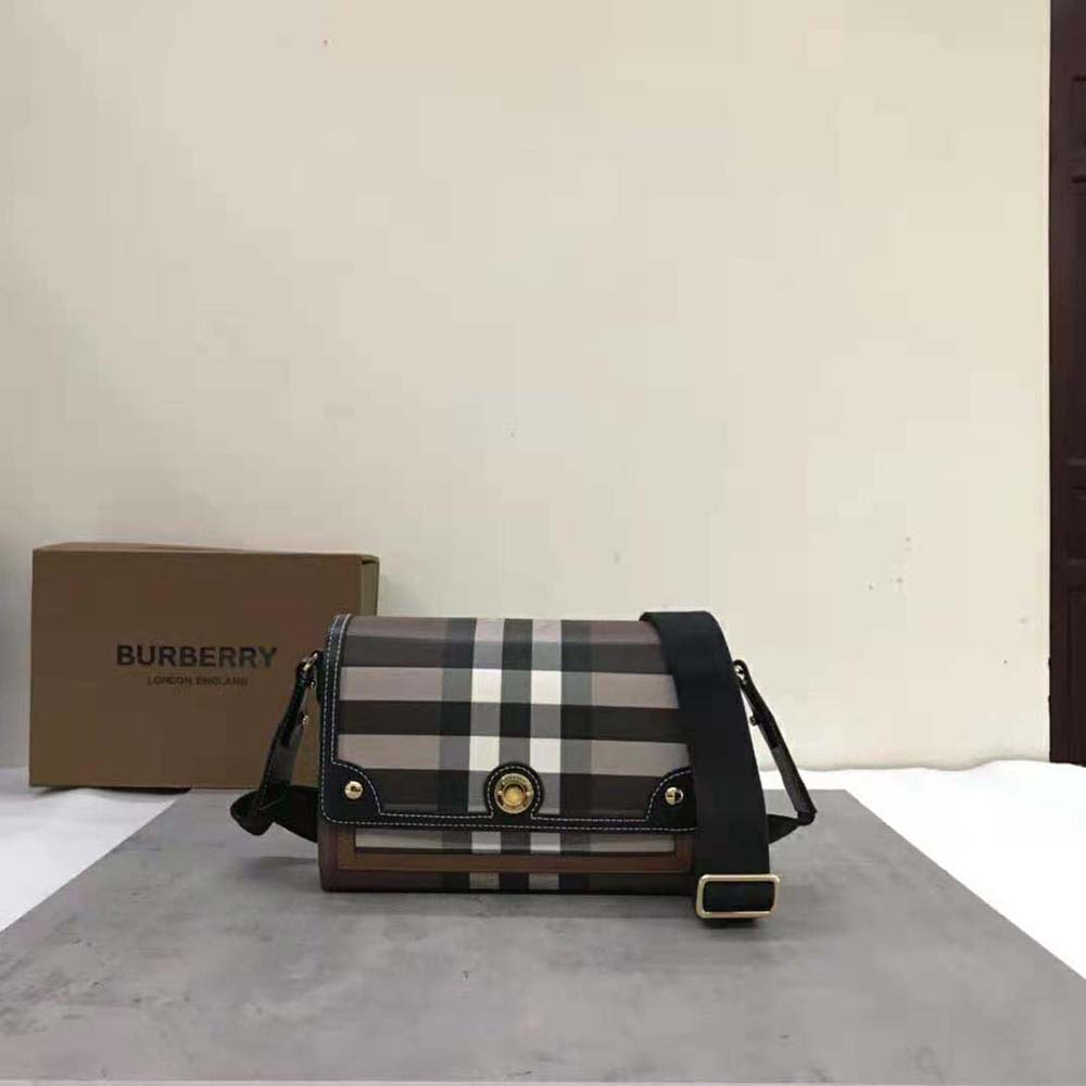 Close-up detail of gold-tone logo-engraved studs on Burberry Women Note Bag