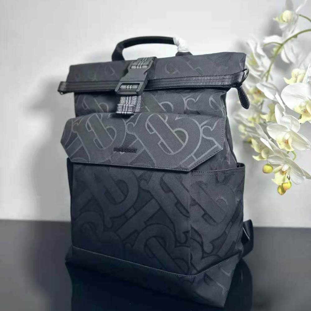Side angle showing silver hardware on Burberry Men Orville Backpack