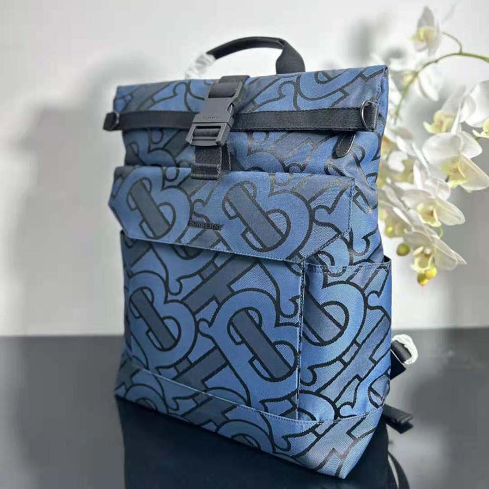 Side profile showing structured silhouette of Burberry Men Orville Backpack navy