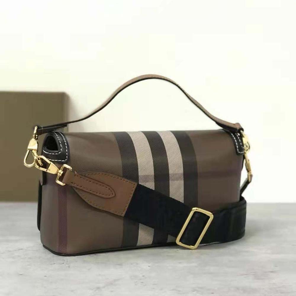 Side angle showing brown leather texture on Burberry Women Top Handle Note Bag