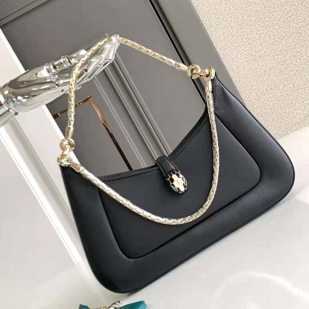 Close-up of gold Serpenti snakehead clasp on Bvlgari shoulder bag