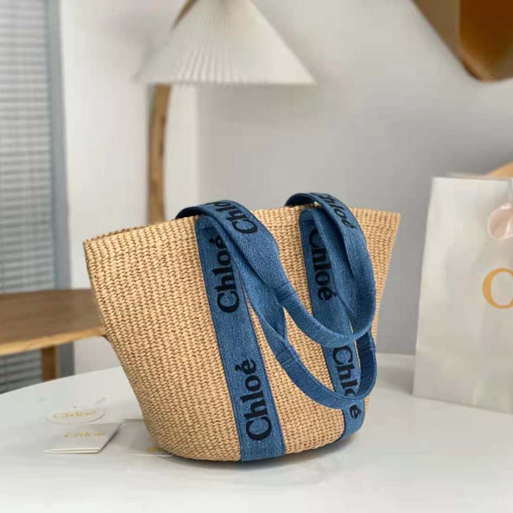Side angle showing spacious interior of Chloe Women Large Woody Basket-Navy