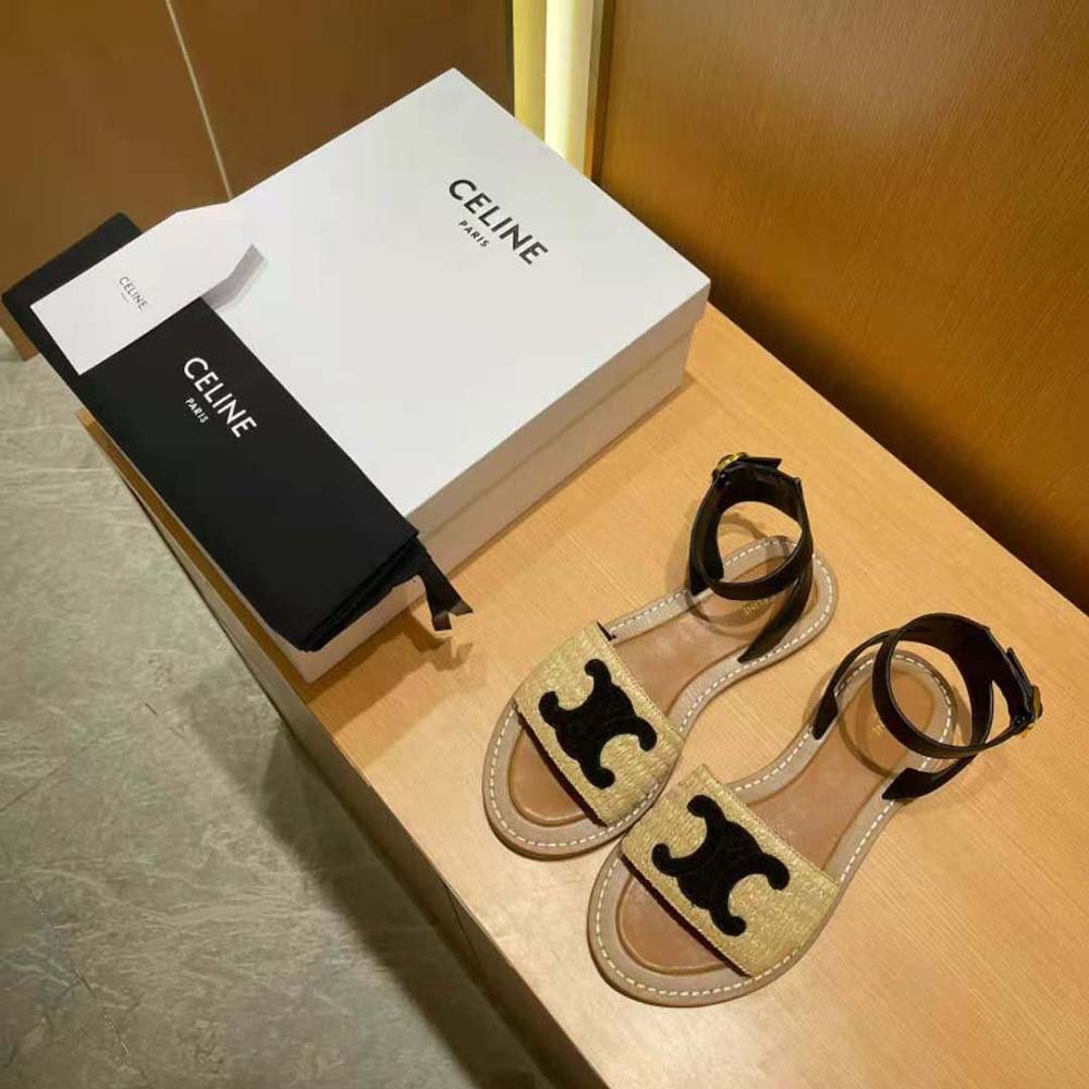Close-up of black calfskin strap and raffia weave on Celine Lympia sandal