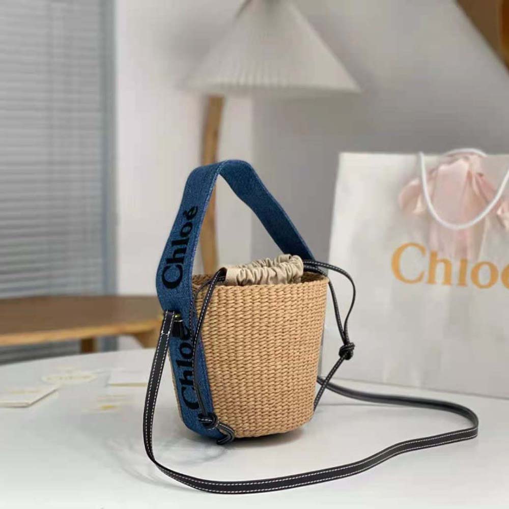 Side profile showing adjustable strap on Chloe Women Small Woody Basket-Navy