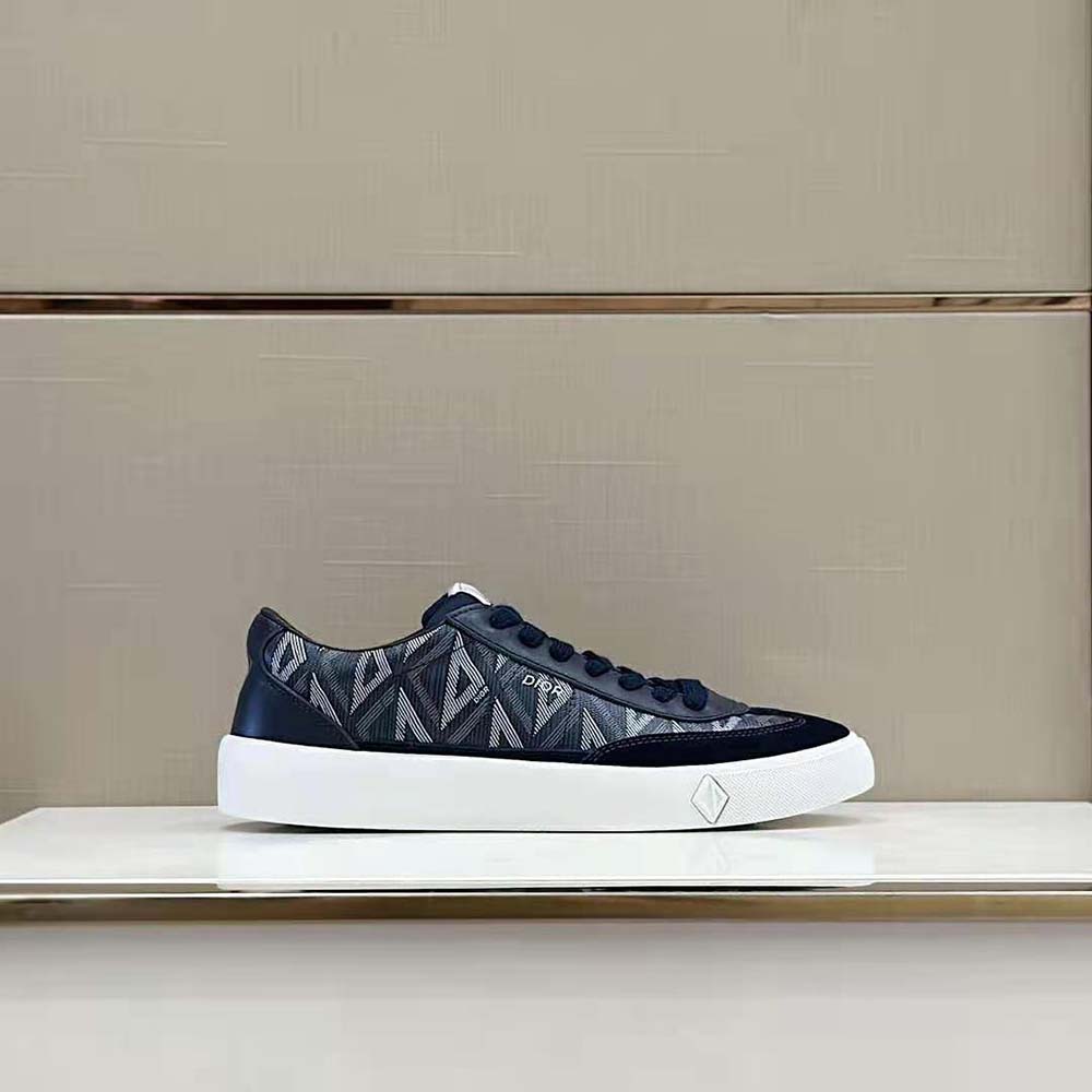 Close-up of navy diamond canvas and smooth calfskin textures on Dior Men B101 Sneaker