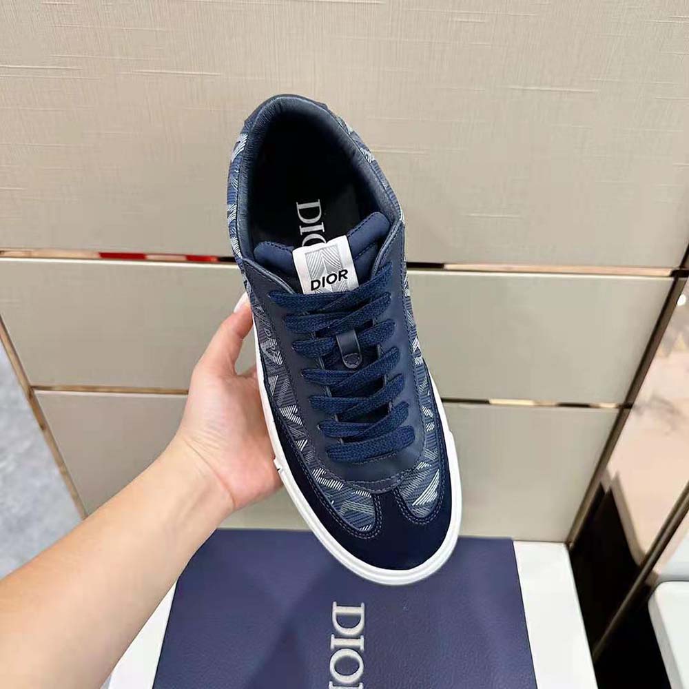 Top view showing navy nubuck overlays and CD logo hardware on Dior Men B101 Sneaker