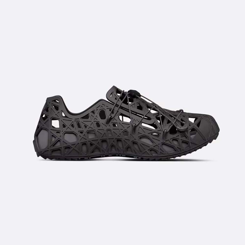 Side profile of Dior Men Warp Sandal Black Cosmo Rubber with warped Cannage motif