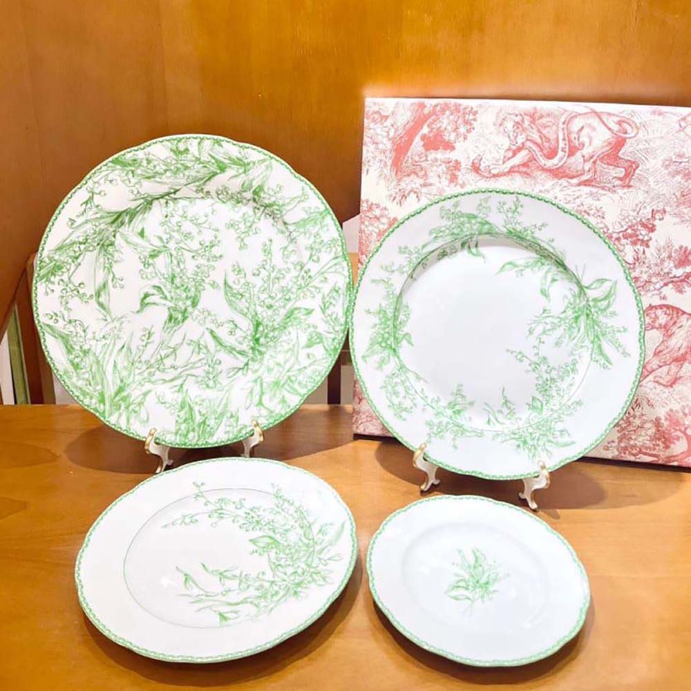 Side angle showing glossy finish of Dior Unisex Decorative Plate Green