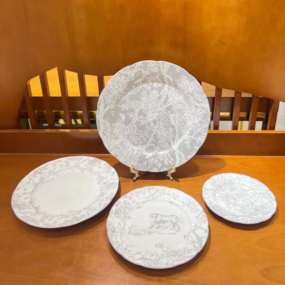 Close-up of Dior Unisex Dessert Plate Gray Toile de Jouy Tiger porcelain texture and print