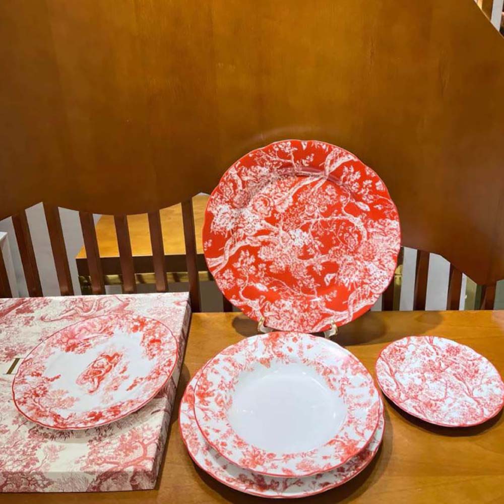 Side angle showcasing sleek silhouette of Dior Unisex Dinner Plate Red Toile de Jouy