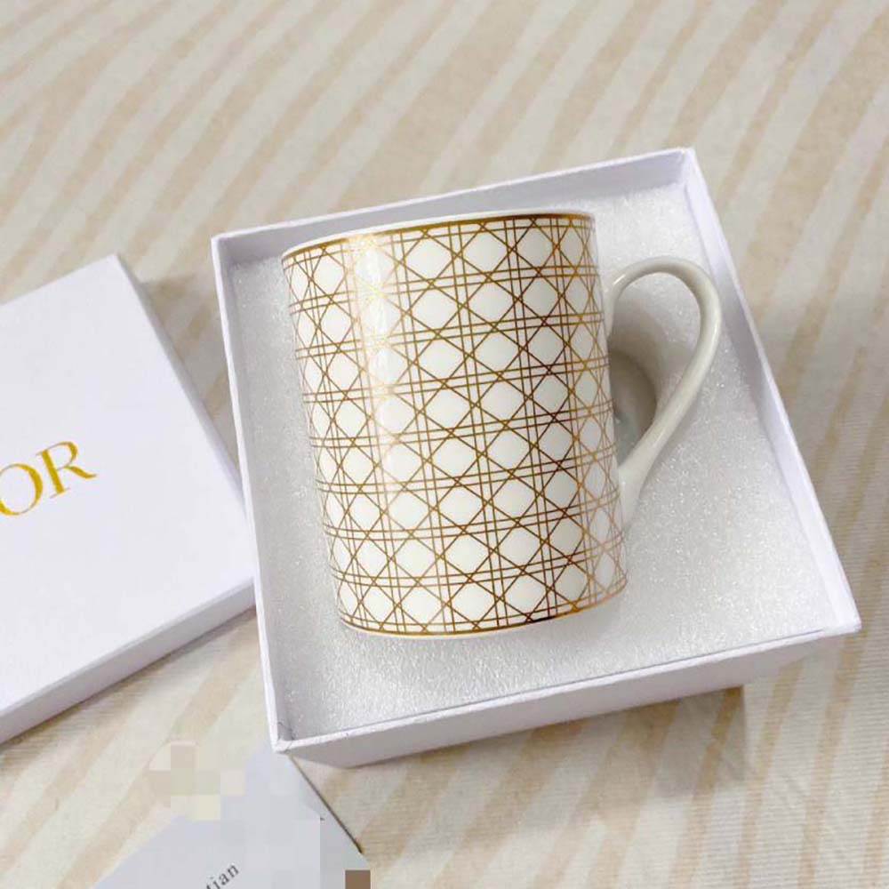 Close-up of gold-tone Cannage hardware on Dior Unisex Mug