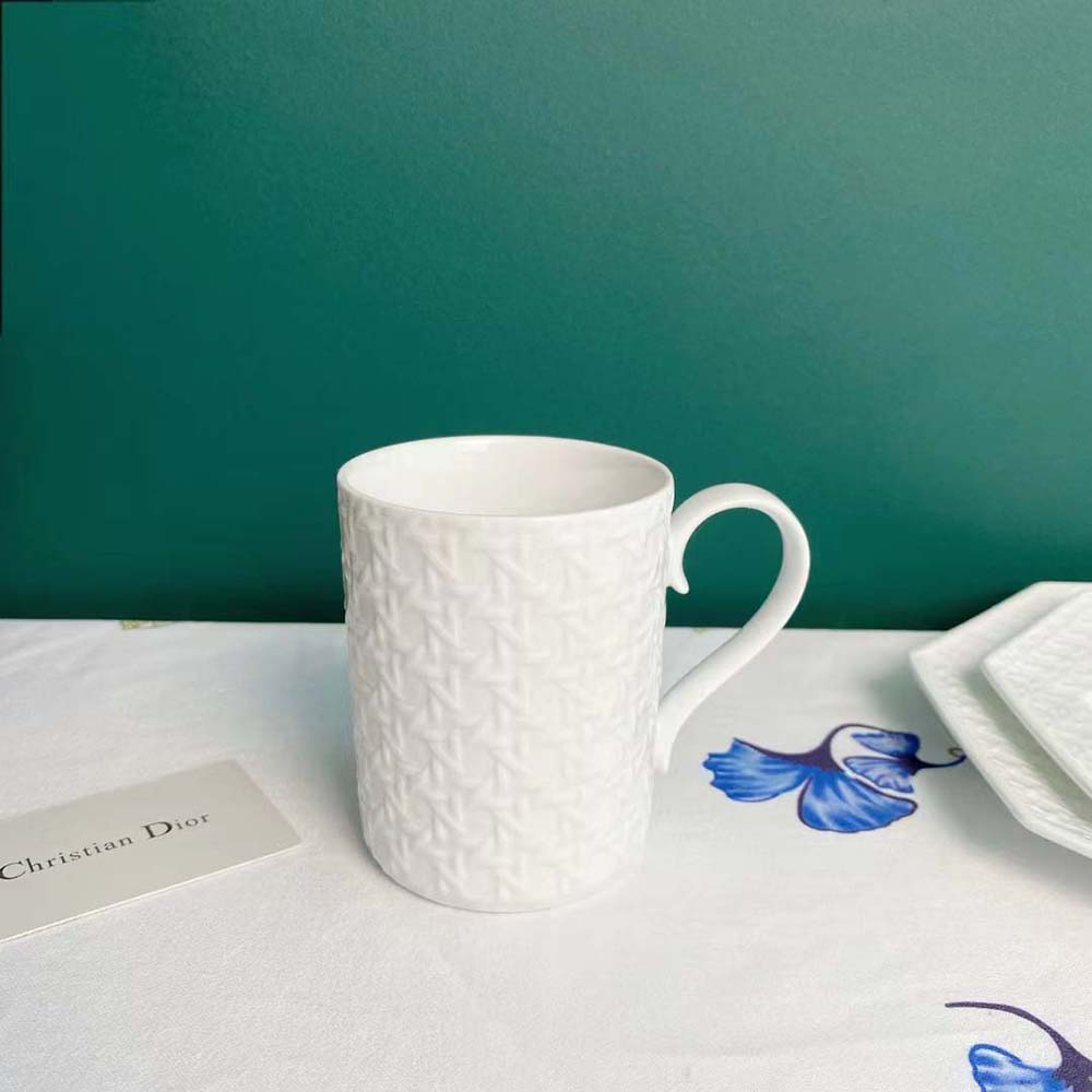 Side angle of glossy white Dior Unisex Mug White Miss Dior Cannage