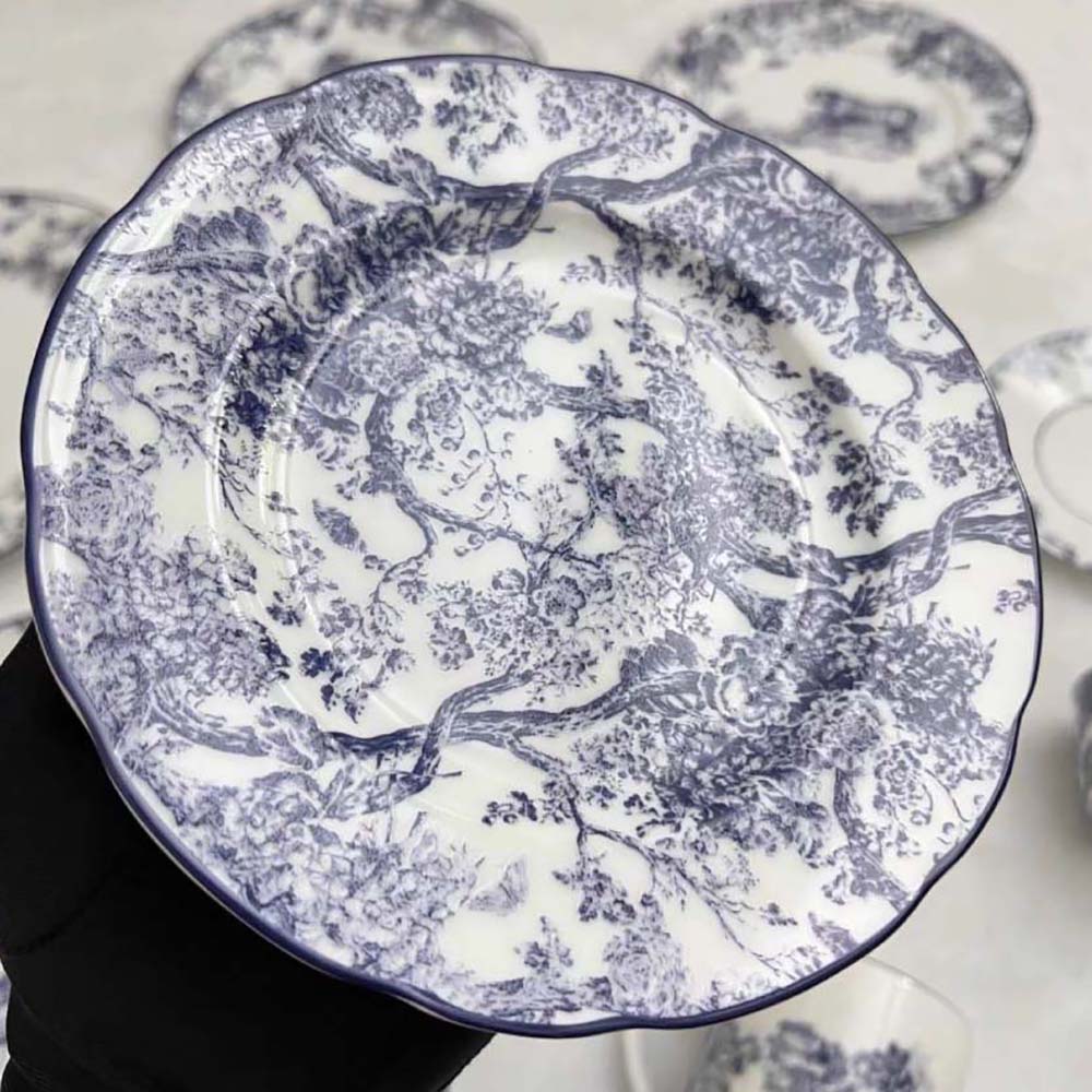 Side angle showing compact silhouette of Dior Unisex Side Plate Blue Toile de Jouy