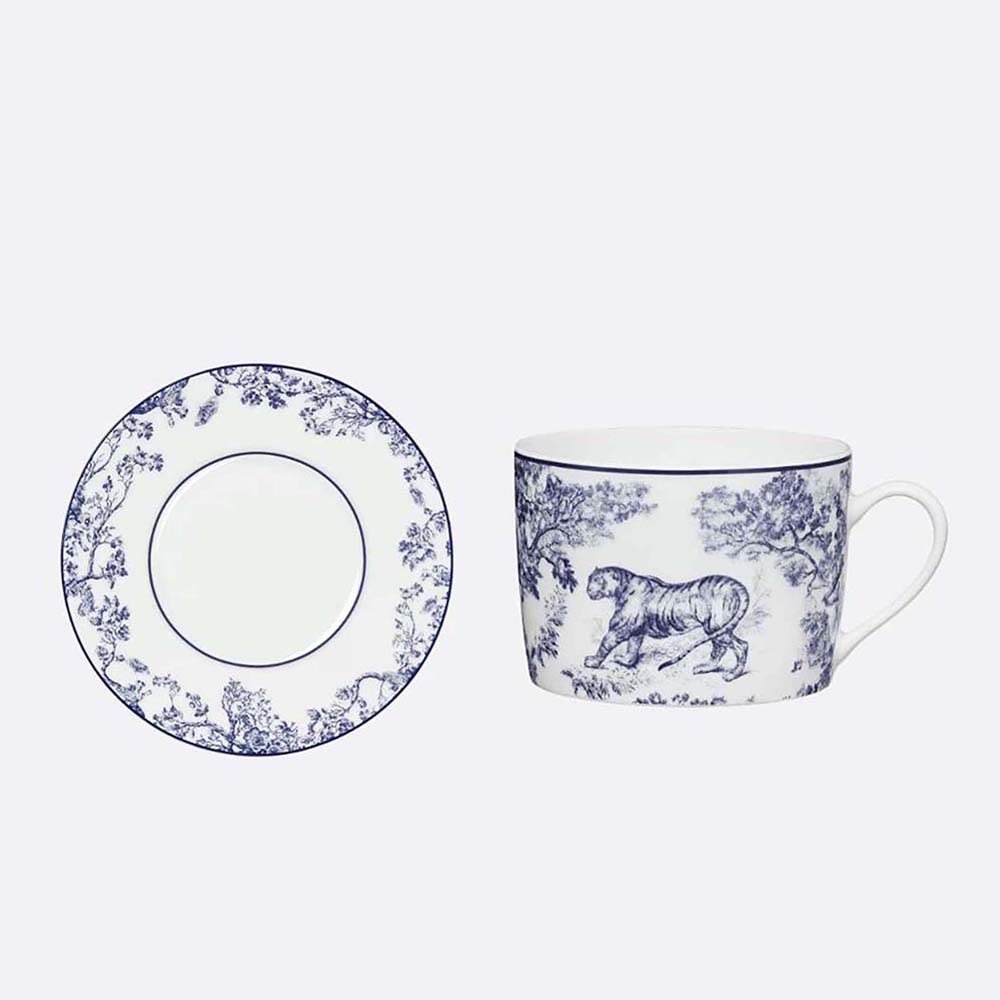 Top view of Dior Unisex Teacup Saucer Blue Toile De Jouy with intricate pattern