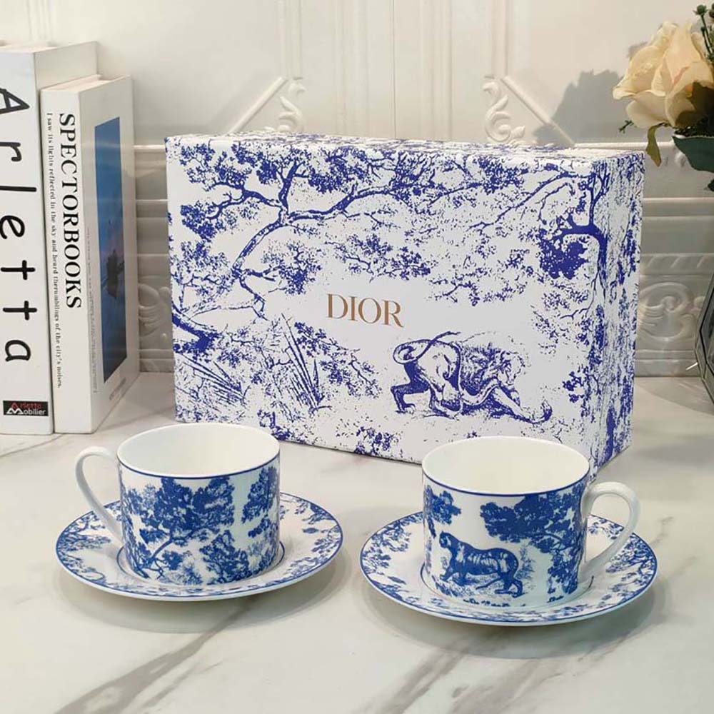 Side angle showing porcelain finish of Dior Unisex Teacup Saucer Blue Toile De Jouy