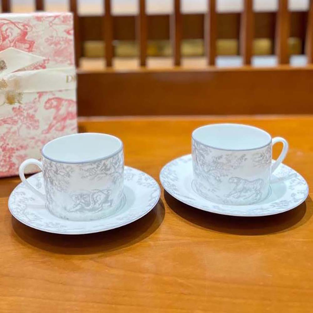 Side angle highlighting the compact size of Dior Unisex Teacup Saucer Gray Toile De Jouy