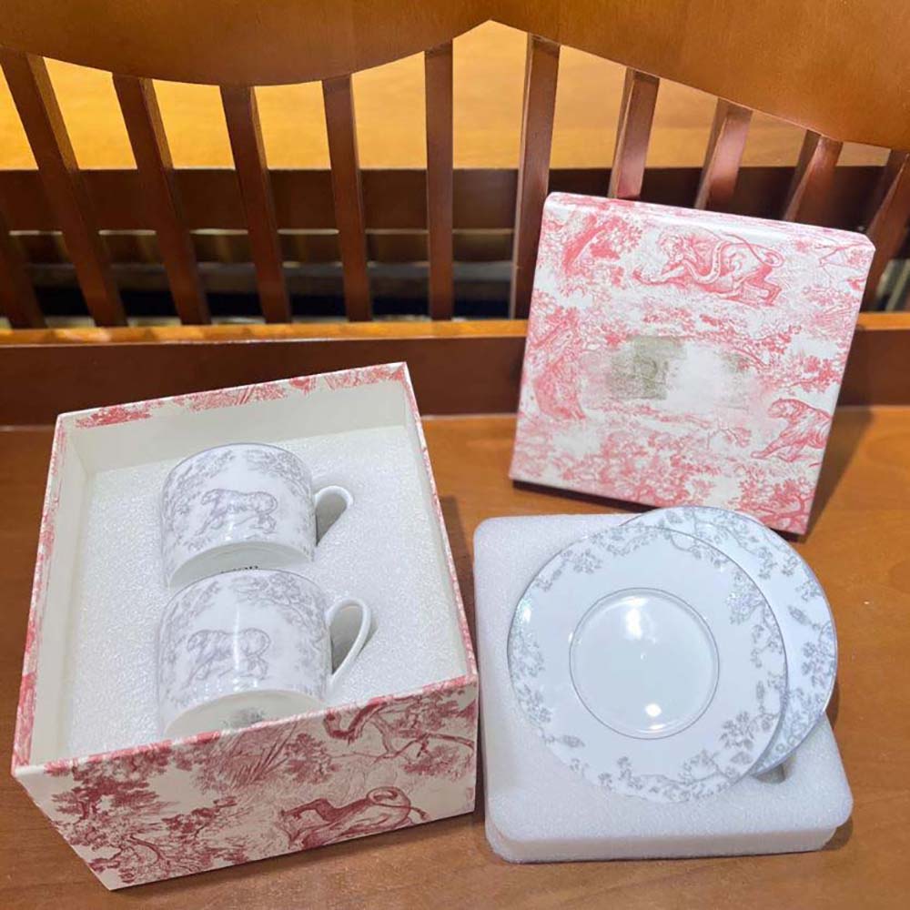 Close-up of Dior embossed signature on the teacup saucer’s edge