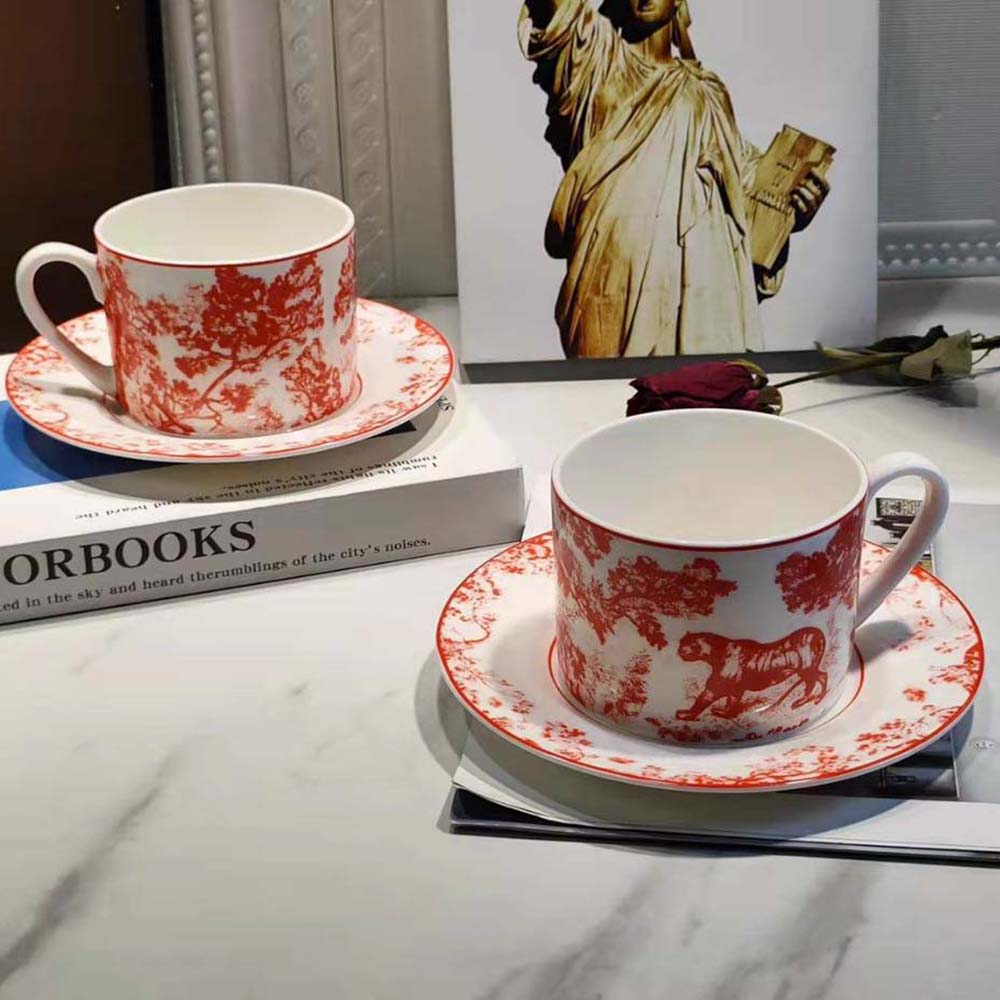 Side profile of Dior Unisex Teacup Saucer Red Toile De Jouy highlighting its compact size