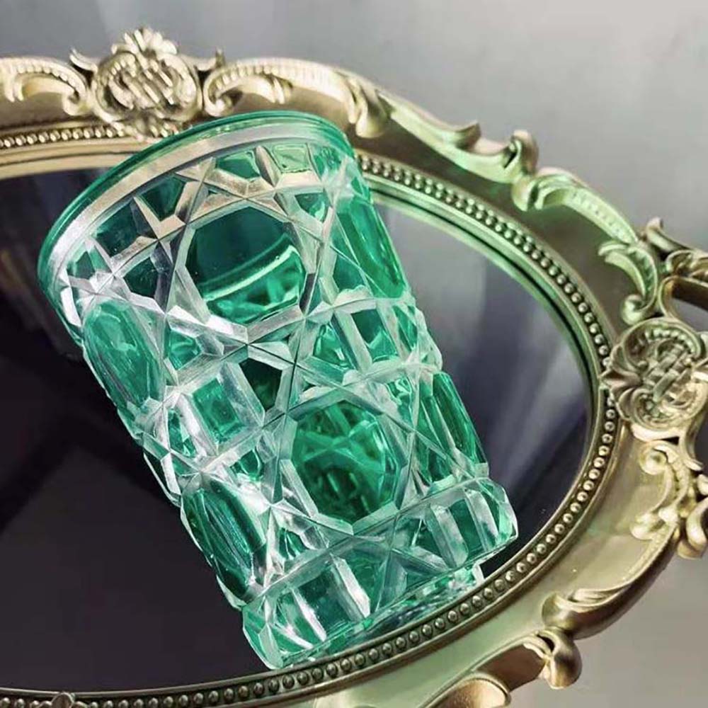 Close-up detail of green glass texture on Dior Unisex Water Glass Green Cannage