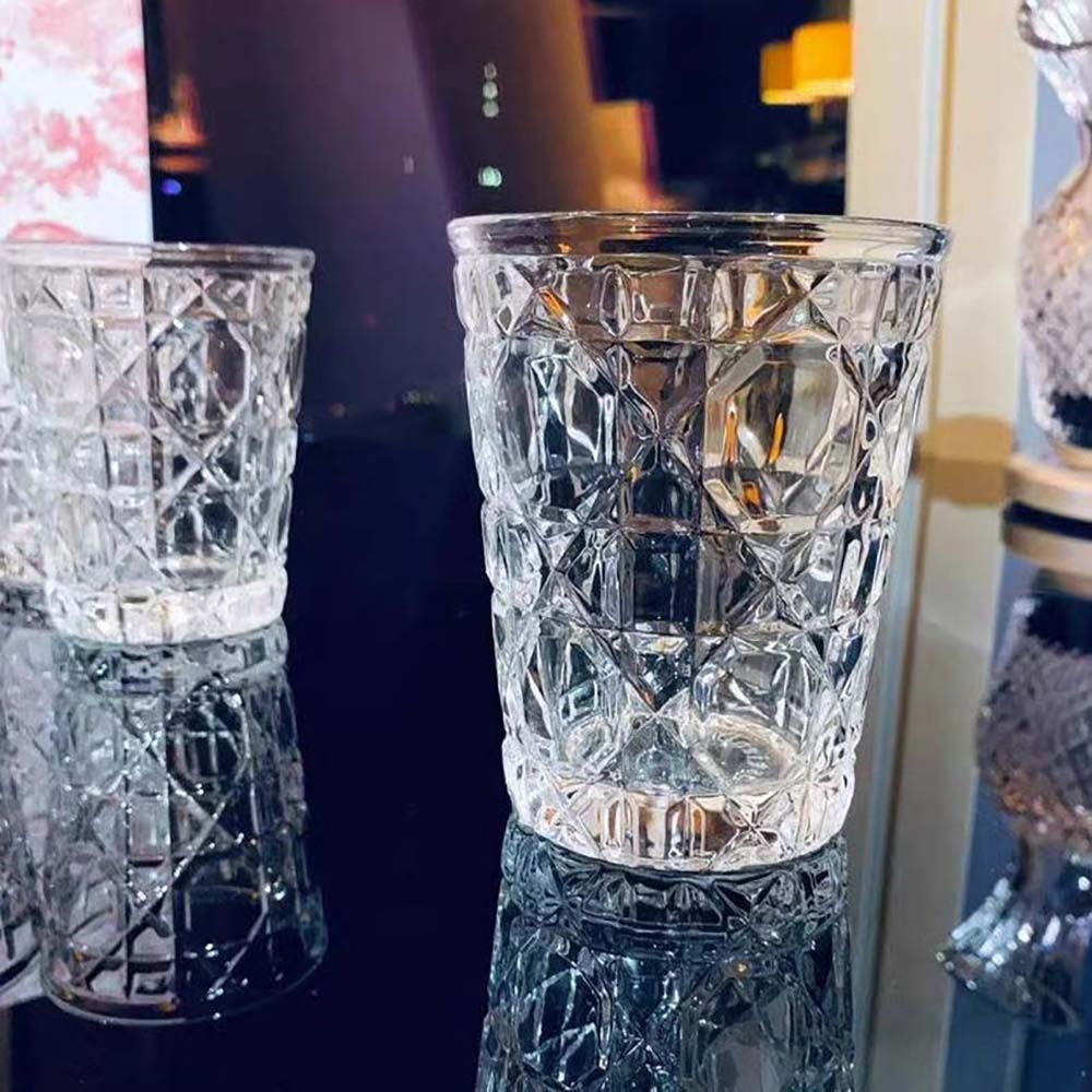 Close-up on white Cannage detail on Dior Unisex Water Glass Transparent Cannage