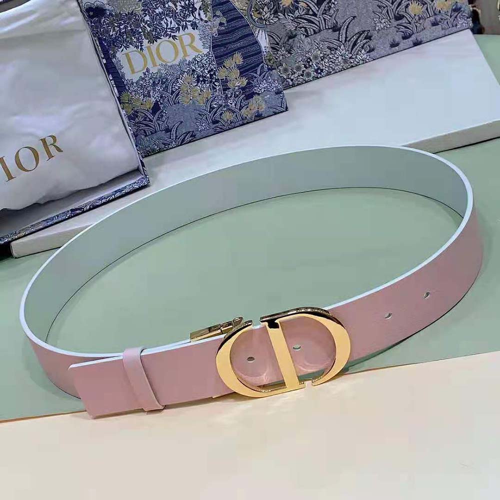Side angle showing reversible dusty ivory and heritage pink leather belt