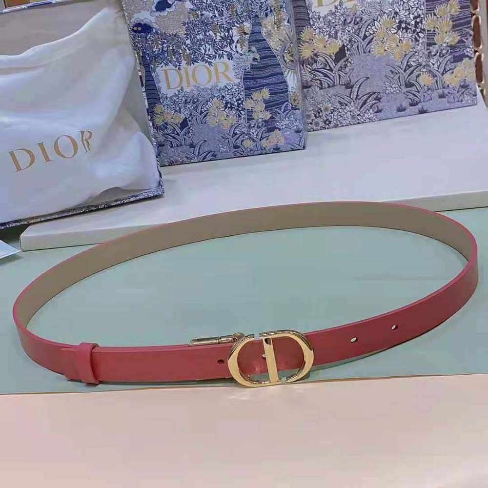Side view showing reversible pink and beige leather belt design