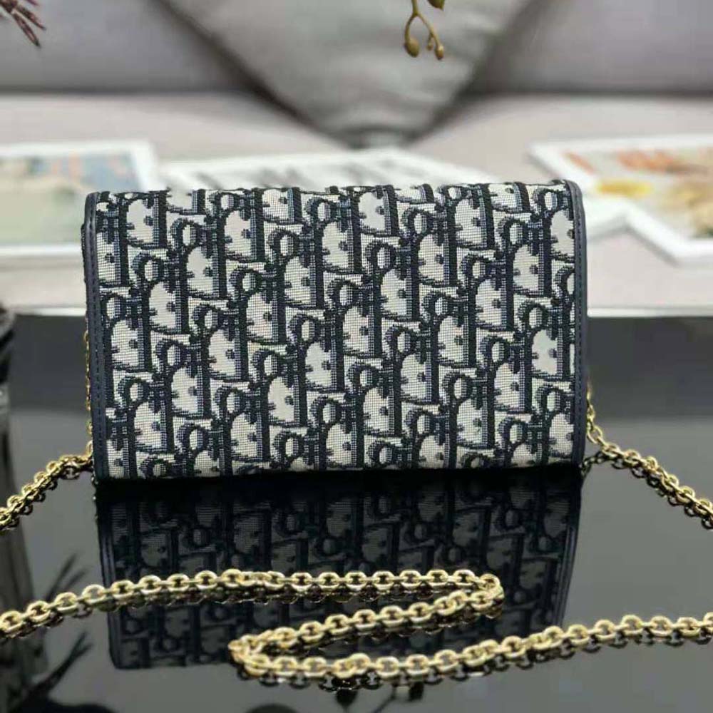 Side angle showing pouch silhouette and chain strap on Dior Women Bobby East-west Pouch