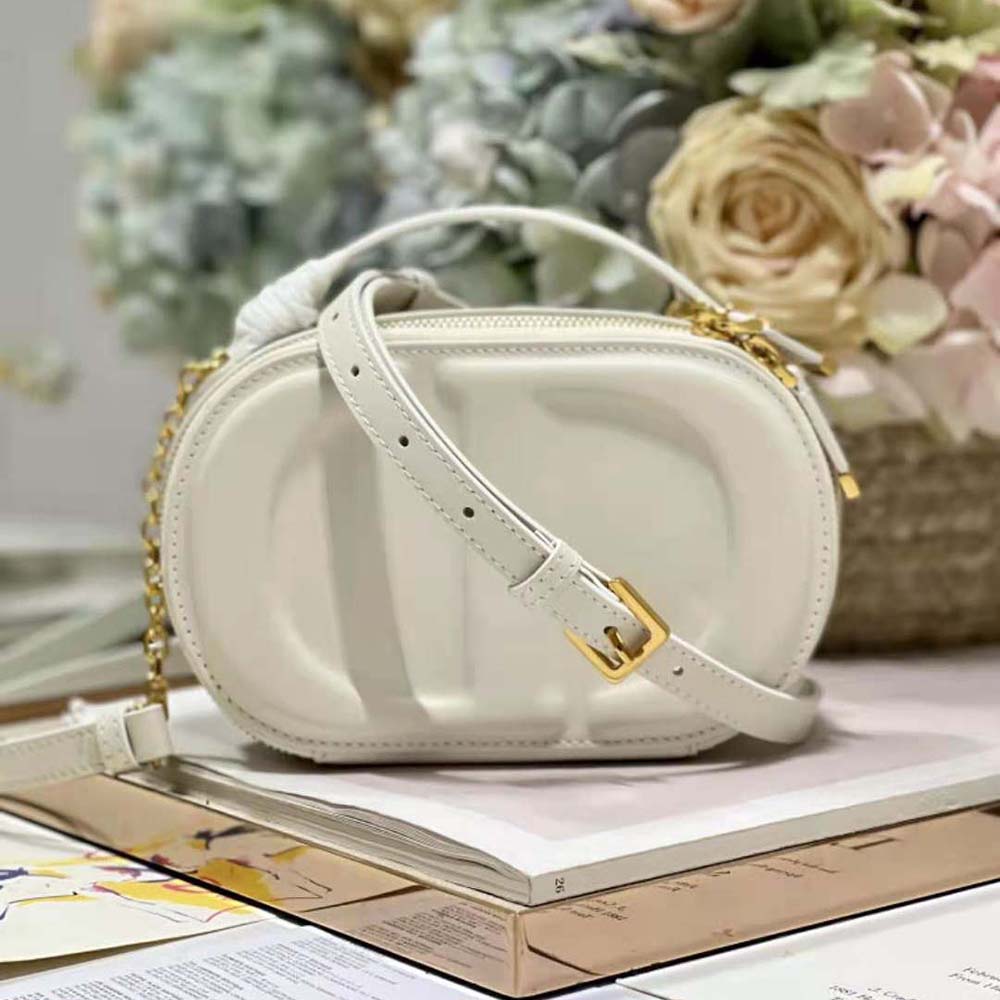 Close-up detail of embossed CD signature on Dior Women CD Signature Oval Camera Bag