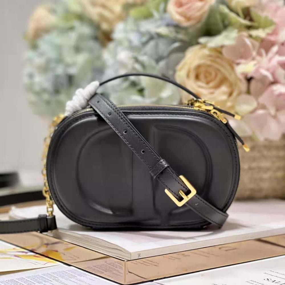 Side angle showing zipper and silver hardware on Dior Women CD Signature bag