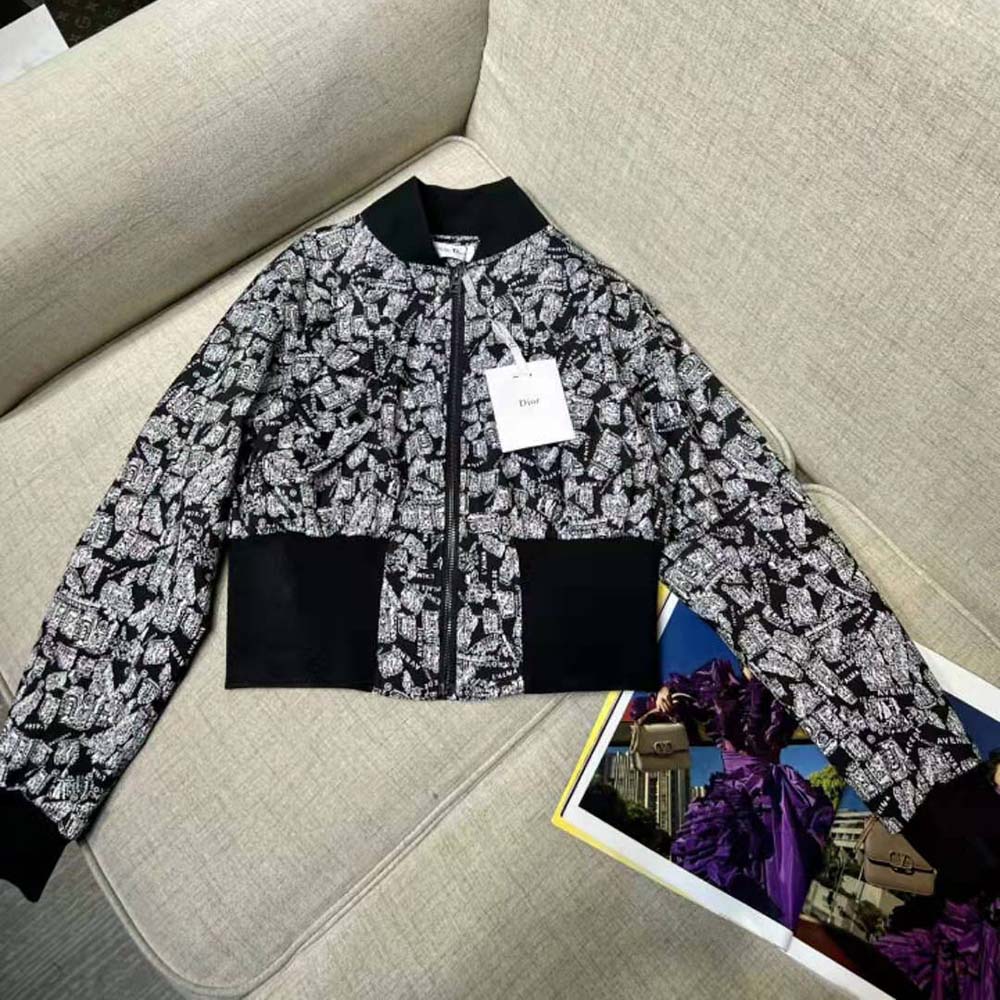 Close-up of zipper and Dior hardware on cropped bomber jacket