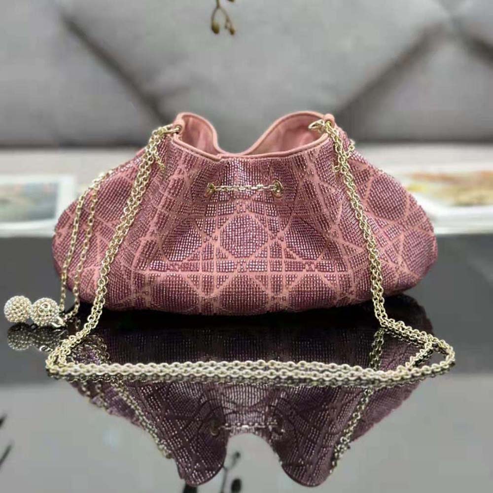 Side angle showing drawstring closure on Dior Women Dior Dream Bucket Bag Ethereal Pink