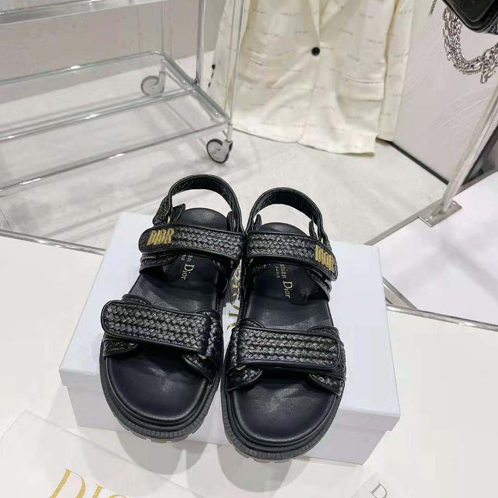 Close-up of gold buckle detail on Dior Women Dioract Sandal Black Braided Raffia