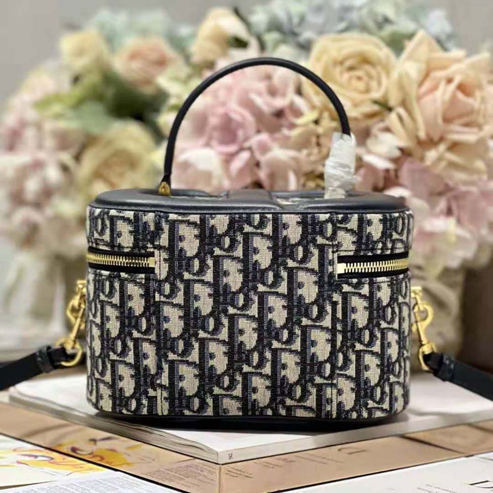 Side angle showing shoulder strap and jacquard texture on Dior vanity case